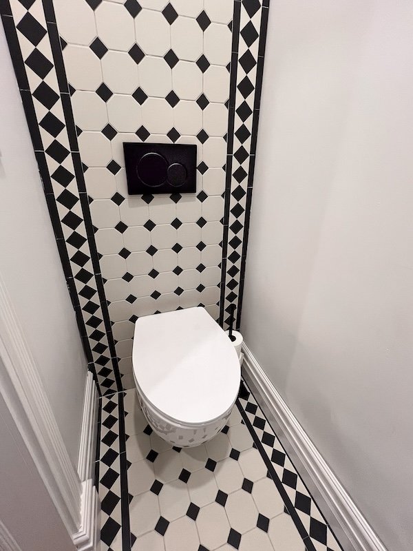 Toronto home renovations - victorian house renoations - powder room  makeover with winckelman tiles, stained glass window and pedestal sink with scalloping detail-2.jpg