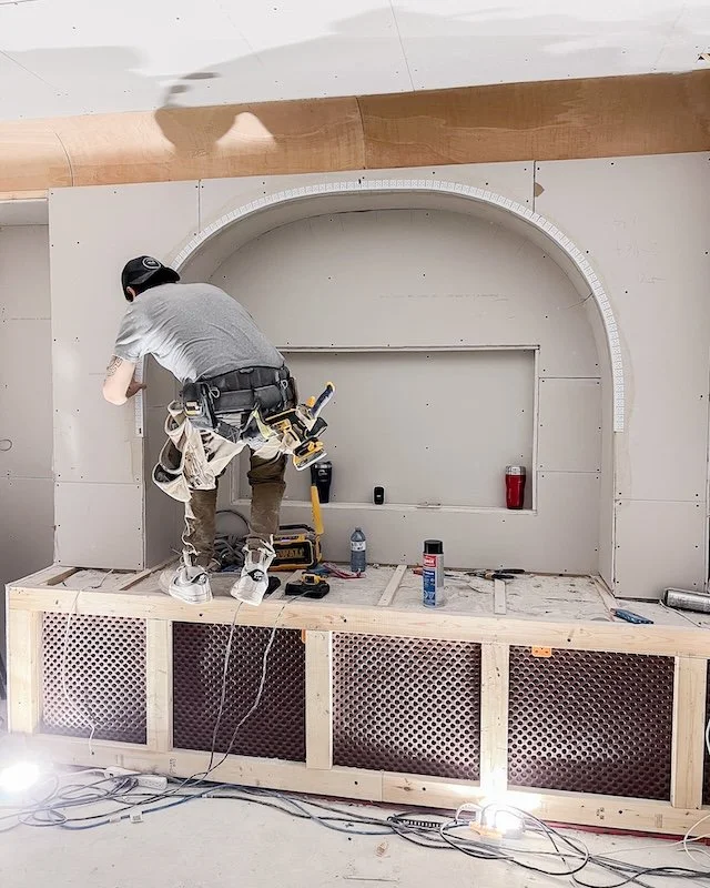 Victorian house - Toronto home renovation - Drywall - Basement theatre room - cove ceiling - TV arch on top of bench footing.jpg
