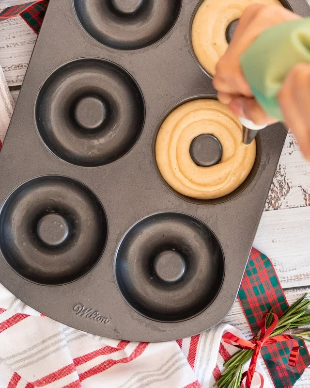 Making eggnog glazed baked doughnuts