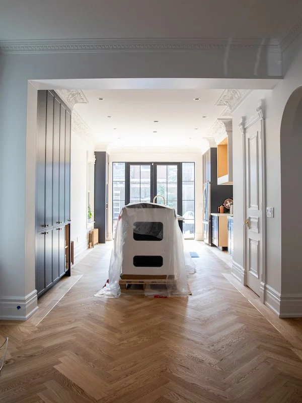 home renovations in toronto - herringbone floors kitchen with brass inlay