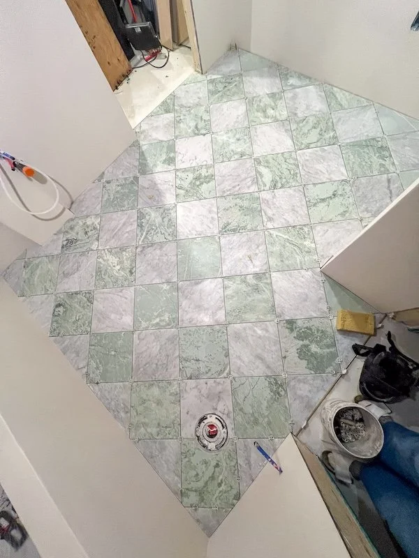 Victorian Home - toronto home renovation - basement renovation - microcement bathroom - green marble tile floors - checkerboard tiles - bathroom tiles