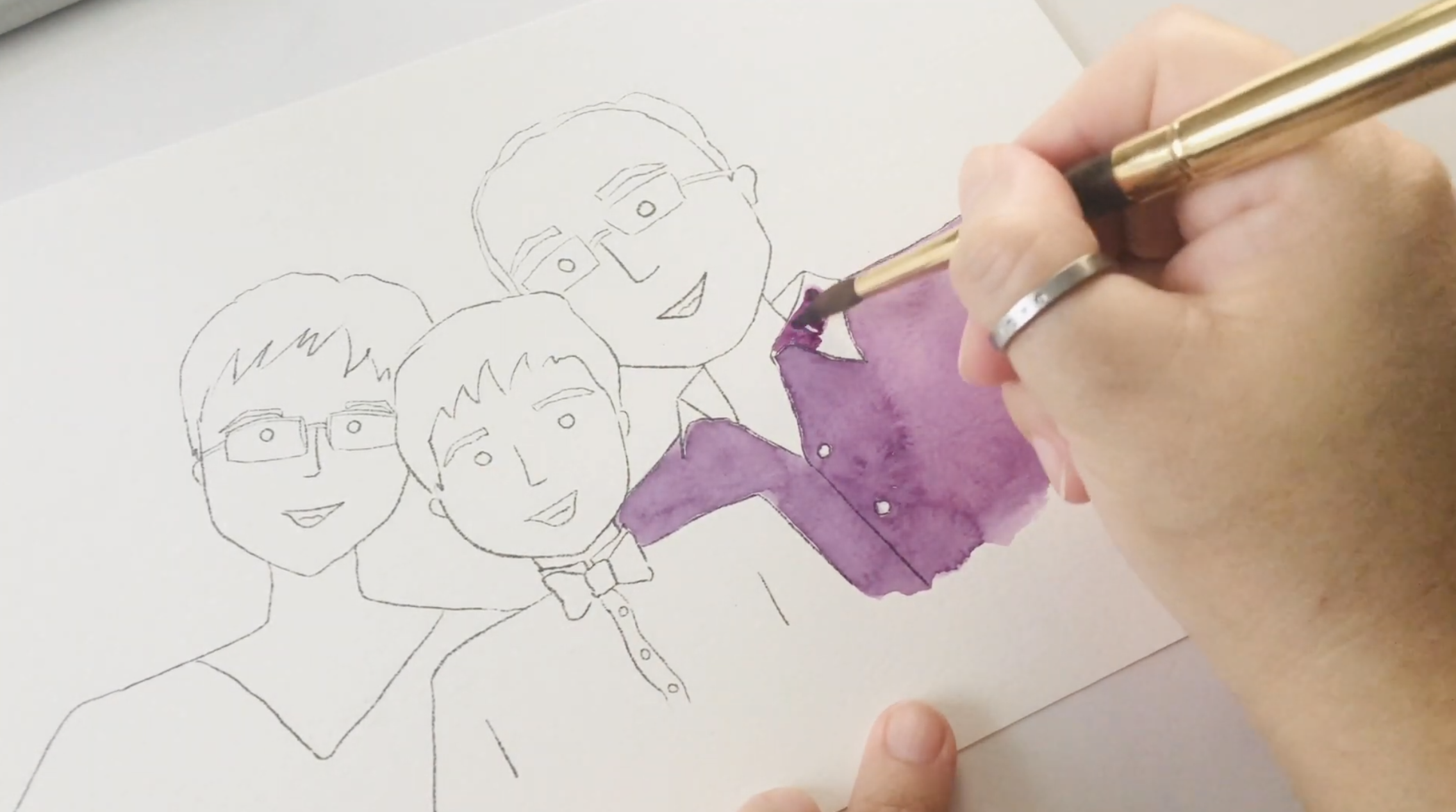 Watercolor layers being added to a hand‑drawn portrait, building color and texture during the Happy B Portraits process.