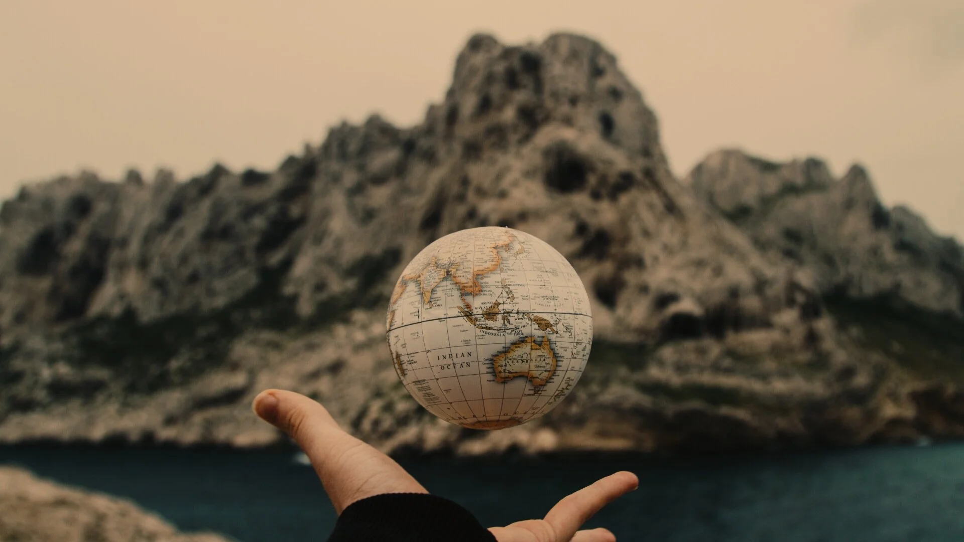 Canva+-+Globe+thrown+up+by+hand.jpg