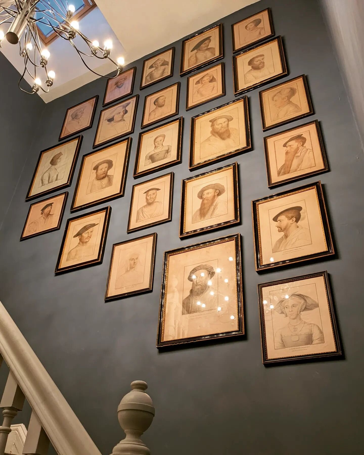 A collection of etchings from around the 1790's by Francesco Bartolozzi. These etchings were reproductions of 16th century drawings by Hans Holbein. 

When working with a high proportion of works in portrait for a stairwell grouping try to avoid foll