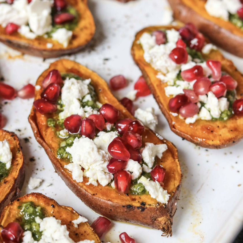 BAKED SWEET POTATO WITH FETA, PESTO AND POMEGRANATE