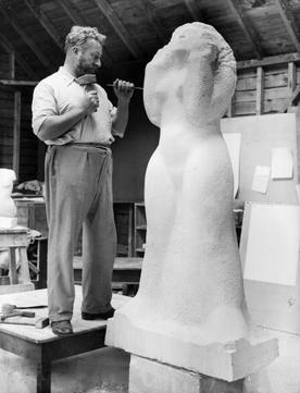 Gibbings at work in his studio in 1933