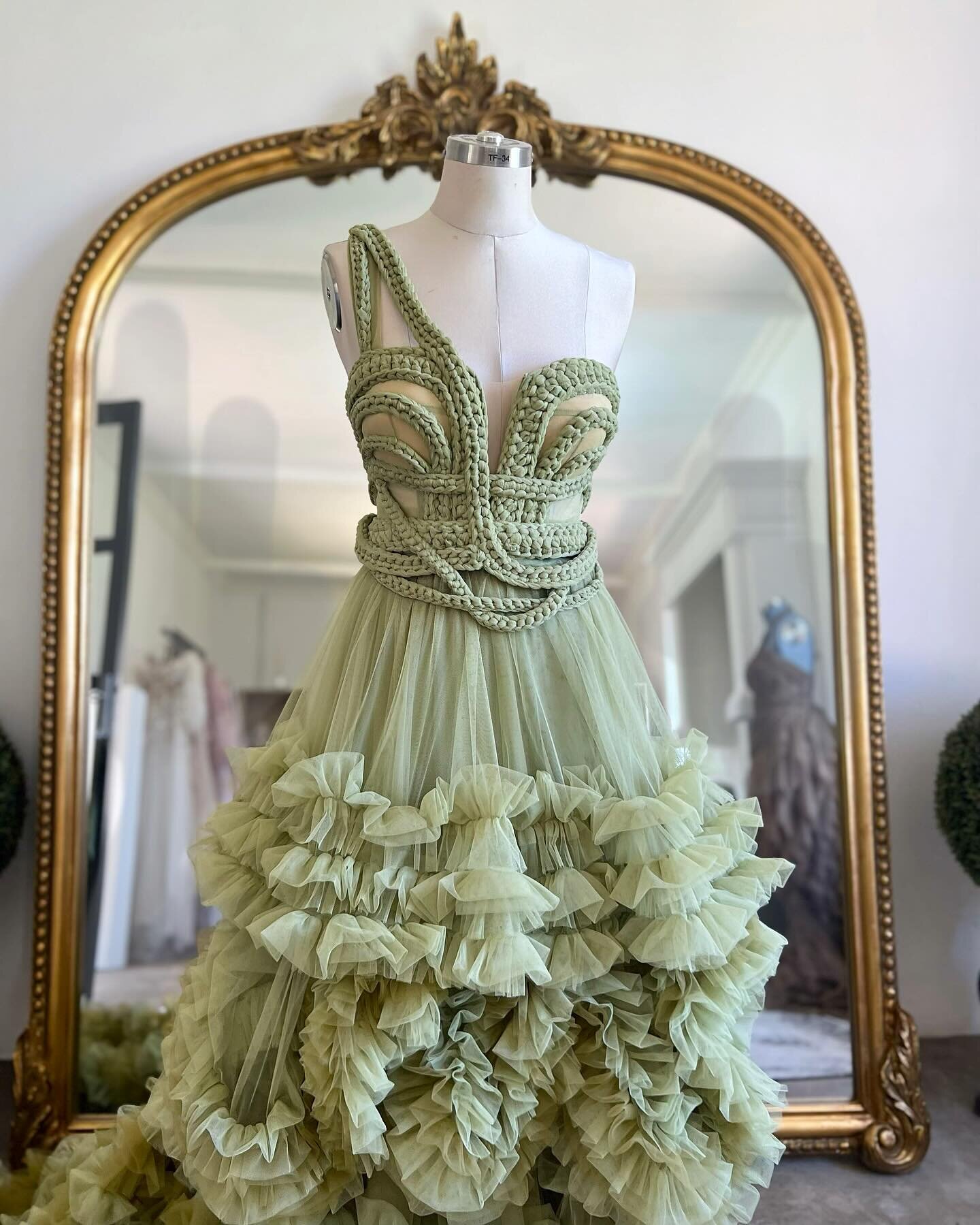 Cascades of green&hellip;

Did you know that the detail on the corset is made up of 10 meters of tulle fabric hand cut into strips becoming roughly 260 meters of tulle &ldquo;yarn&rdquo; , then crocheted into different textures before placed and sewe