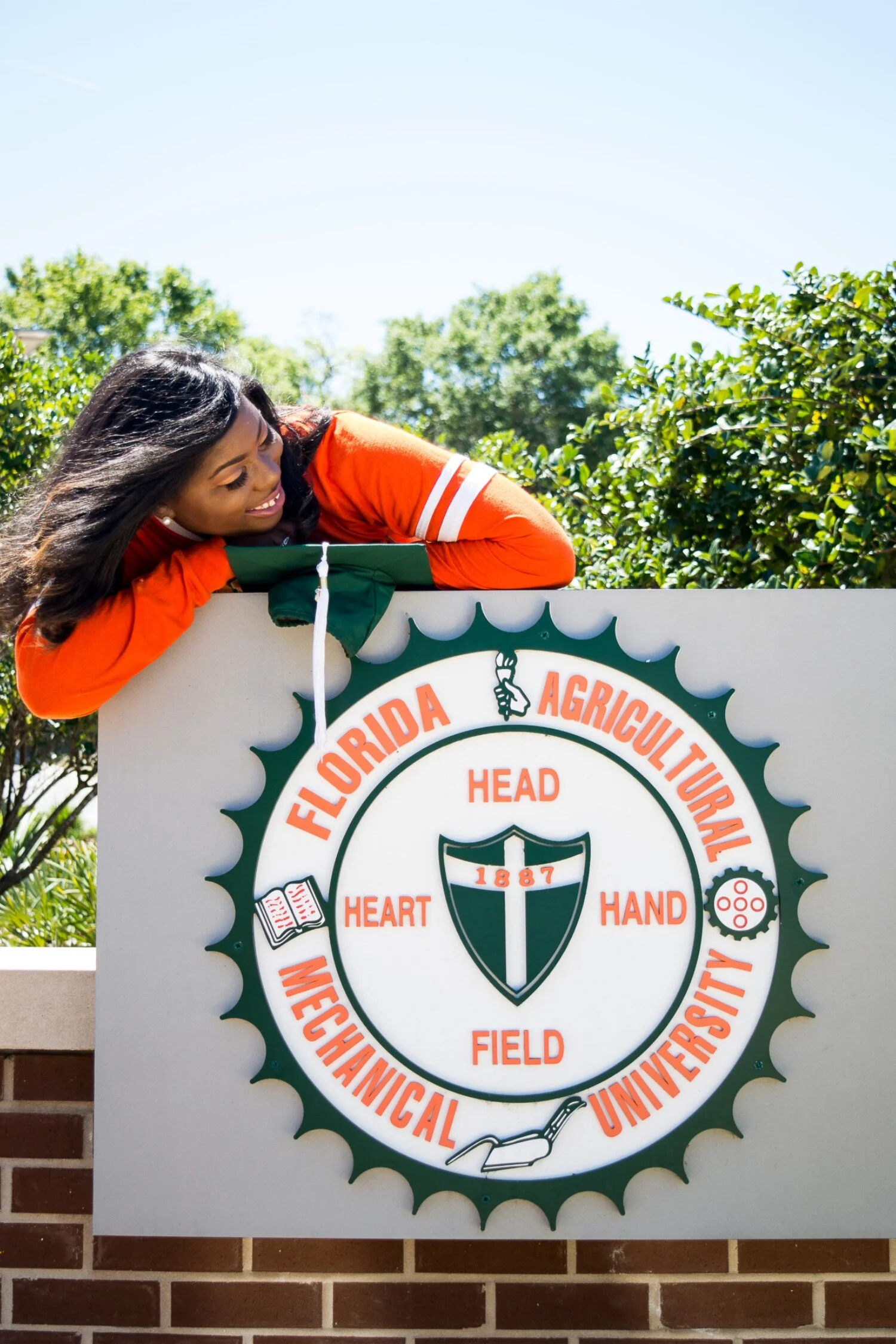 Graduate Shaperlya posing on new FAMU roundabout