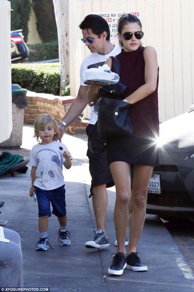 Alessandra Ambrosio wearing a French Connection Hendy Mixed Media Tiered Shift Dress and Vans PRM Leather Era sneaks.