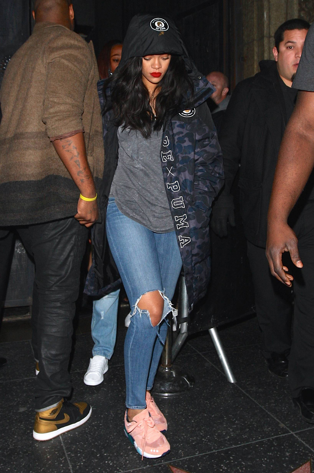 Rihanna was spotted in Hollywood keeping a low profile in a Puma x Bathing Ape Evospeed FC Jacket and Puma x Alife R698 sneaks.