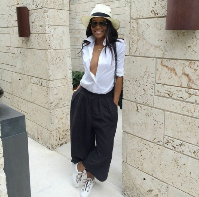 We love Gabby Union. The actress kept it easy and breezy in a plunging button up, wide-leg chinos, and a pair of low top lace ups. Sneaker style on win.