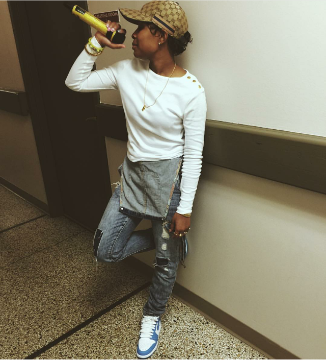 Dej Loaf kept a casual profile in overalls and a pair of Air Jordan 1 Retro High OG "UNC" sneaks.
