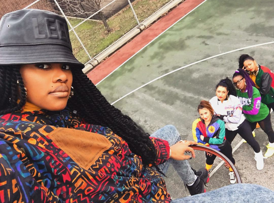 New mommy Teyana Taylor was back to work in all of her round the way girl glory! The singer took to the rim in a pair of Air Jordan 14 Retro "Dirty Bred" sneaks for a perfect shot with her posse. LOVE.