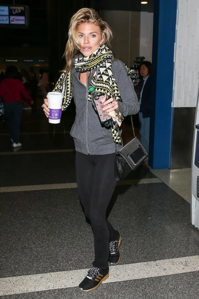 90210 alum Annalynn McCord was busy nabbing caffeine at LAX in a pair of adidas ZX Flux in black/gold. 