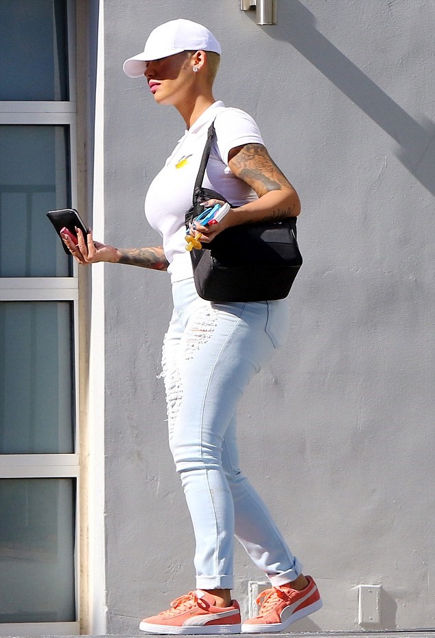 Amber Rose ran errands in a rosey pair of Puma Suede Basket sneaks.