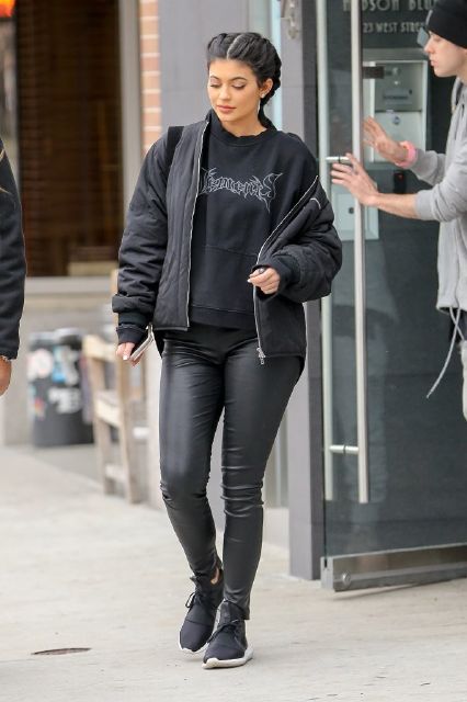Kylie Jenner paired her adidas Tubular Defiant with leather and sweats for a comfy combo.