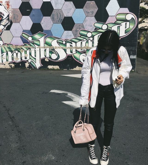 Kylie Jenner kept it cute for some artistic snaps wearing Comme des Garcons Play Chuck Taylor High-Top Sneakers.
