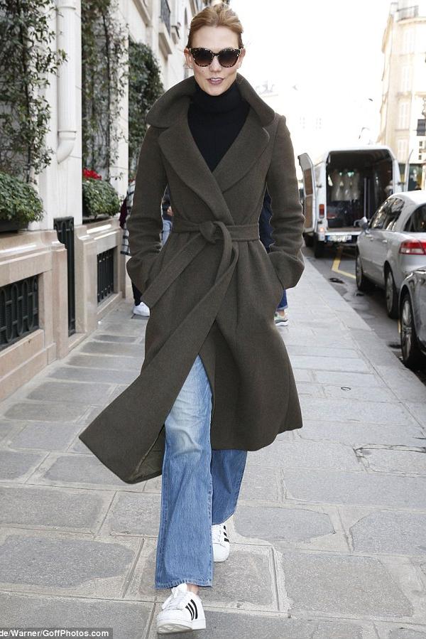 Karlie Kloss ventured out onto Paris streets wearing Adidas Originals Superstar Sneakers, a Victoria Beckham Merino Wool Turtleneck and a Cashmere and Helmut Lang Double Face Wool Coat in Bark. Tres chic!