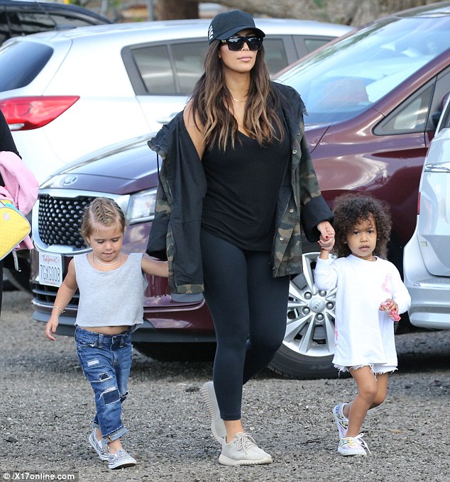 Kim Kardashian was up for an Easter egg hunt with the girls wearing a T by Alexander Wang Classic Mini Pocket Tank, Celine Cl 41756s Zz Top Sunglasses, Lululemon Align Pants in Black, Anti Social Social Club Weird Cap in Black, Yeezy Camouflage Coat and Adidas Yeezy 350 Boost Sneakers in Moonrock.