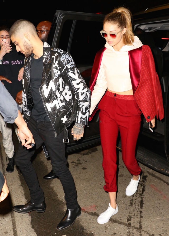 Gigi Hadid strolled hand-in-hand with boyfriend Zayn Malik as the two made an appearance at his album listening party over the weekend. Gigi made a colorful splash in adidas Superstar sneakers , a red pantsuit and Komono Stella Pale Blush Sunglasses .