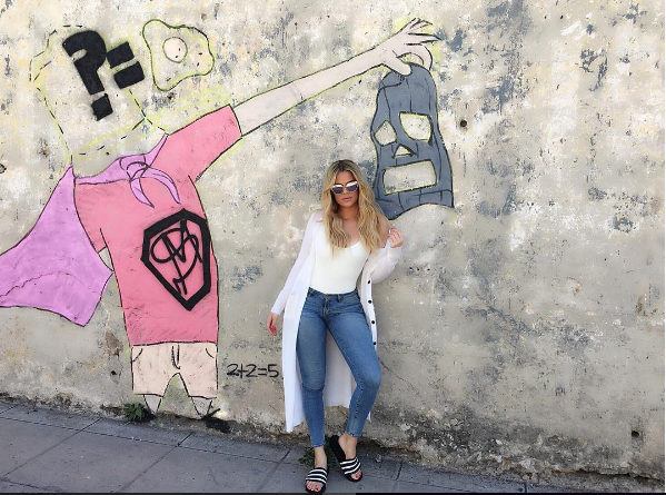 Khloe Kardashian jetted to Cuba for a family vacay (with camera crew in tow, obviously) and stopped to grab a snap in a pair of adidas Adilette slides . 