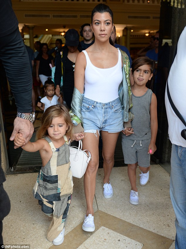 Kourtney Kardashian, also on the fam siesta in Cuba, stepped out extra cute with a Givenchy Small Antigona Tote, Vans Classics and a Gucci Blooms Print Bomber Jacket.