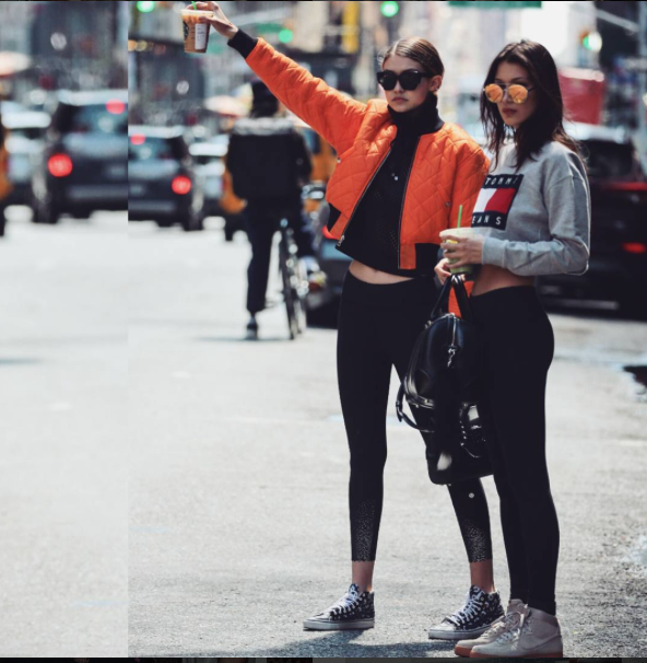 Gigi and Bella Hadid took NYC in epic sister style. Bella stepped out in Nike Air Force 1 High 'Suede' Sneaks paired with GracedbyGrit leggings , Quay Circus Life Sunnies and a cropped Tommy Hilfiger Denim Flag Sweatshirt . Gigi was a bright spot in Vans 'Love Me Love Me Not' Sk8-Hi Sneaks and a V Files Orange Cropped Bomber jacket. 