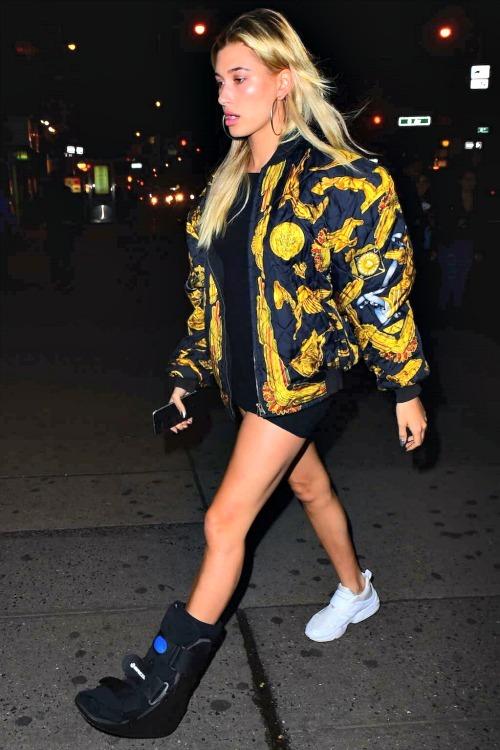A walking boot didn't stop Hailey Baldwin from making a style statement! Hailey paired Puma x Stampd Blaze of Glory Strap Sneaker(s) with a black mini and a Hermes Bomber Jacket.