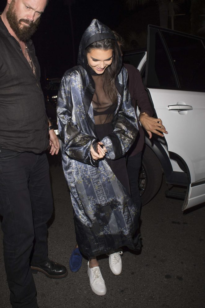 Kendall Jenner went sheer for a nightclub appearance in Cannes over the weekend. The model stepped out fresh in a cape and dress from Astrid Anderson's Spring 2016 collection and her favorite Kenneth Cole 'Kam' sneakers.