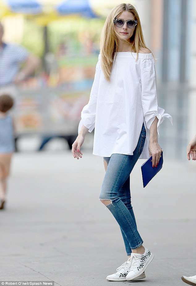 Olivia Palermo put a stylish take on her floral Moncler Gamme Rouge Muguet Sneakers with a Tibi Satin Poplin off-the-shoulder Tunic, AG Legging Ankle Jeans in 11 Years, and a pair of TDF Fendi Galassia Marble Cat Eye Sunnies. She is always FAB.