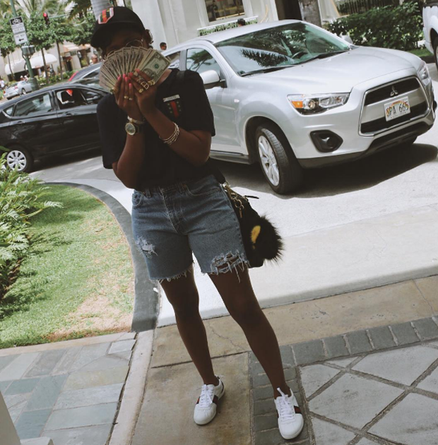 Dolla Dolla Bill: DeJ Loaf flashed her bands and kept it cute in cutoffs and Gucci sneakers.