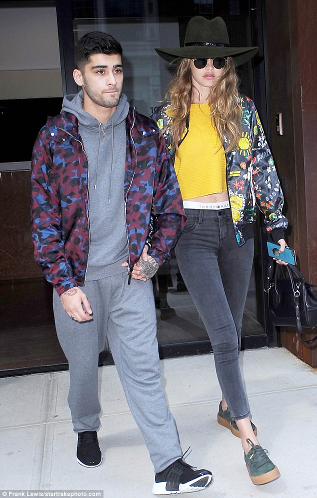 Gigi Hadid zoomed out of her NYC condo looking very boho chic in Ray-Ban Rb3447 Round Metal Sunglasses, an adidas x Pharrell Williams Artist Printed Blouson Jacket and Puma by Rihanna Women’s Green-Bordeaux Creepers.