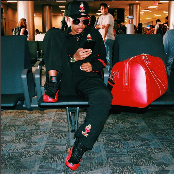 Dej Loaf waited to take the skies over the weekend. The rapper posted up in the terminal (on on Instagram) in a pair of the Air Jordan 12 'Flu Game'