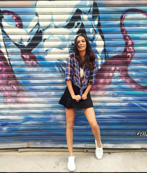 More Puma Creeper love as Joan Smalls kept it coy in a black mini and plaid button down.
