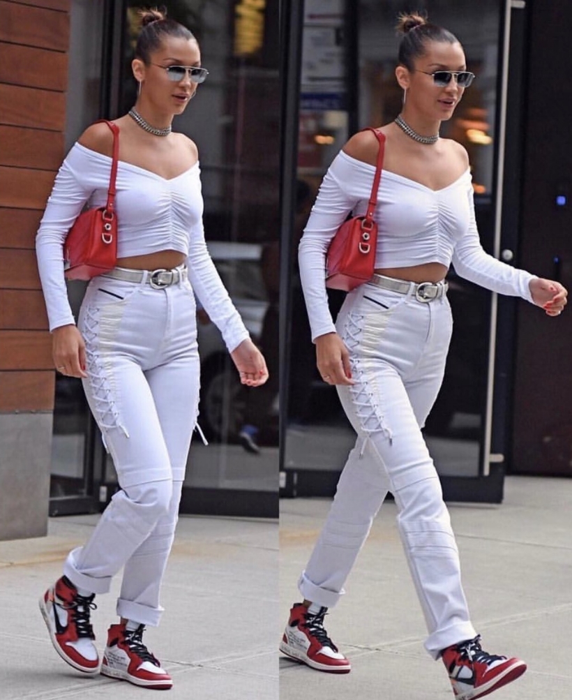 Bella Hadid in white Nike sneakers and denim shorts at Coachella