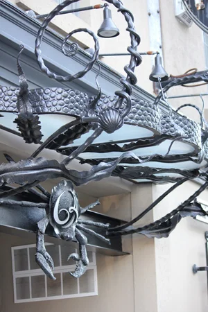 Zee Grill's seafood themed canopy in wrought iron