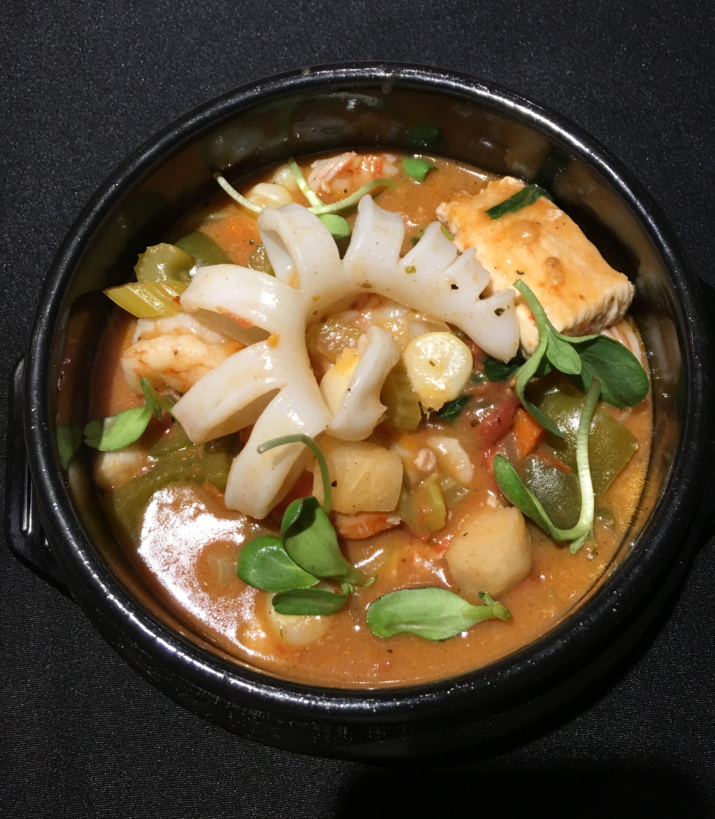 Sudado - Peruvian Seafood Stew w/ Fish, Calamari, Scallops, Shrimp, Jicama, White Corn, Sweet Potato, Aji Peppers, Spicy Tomato Clam Broth