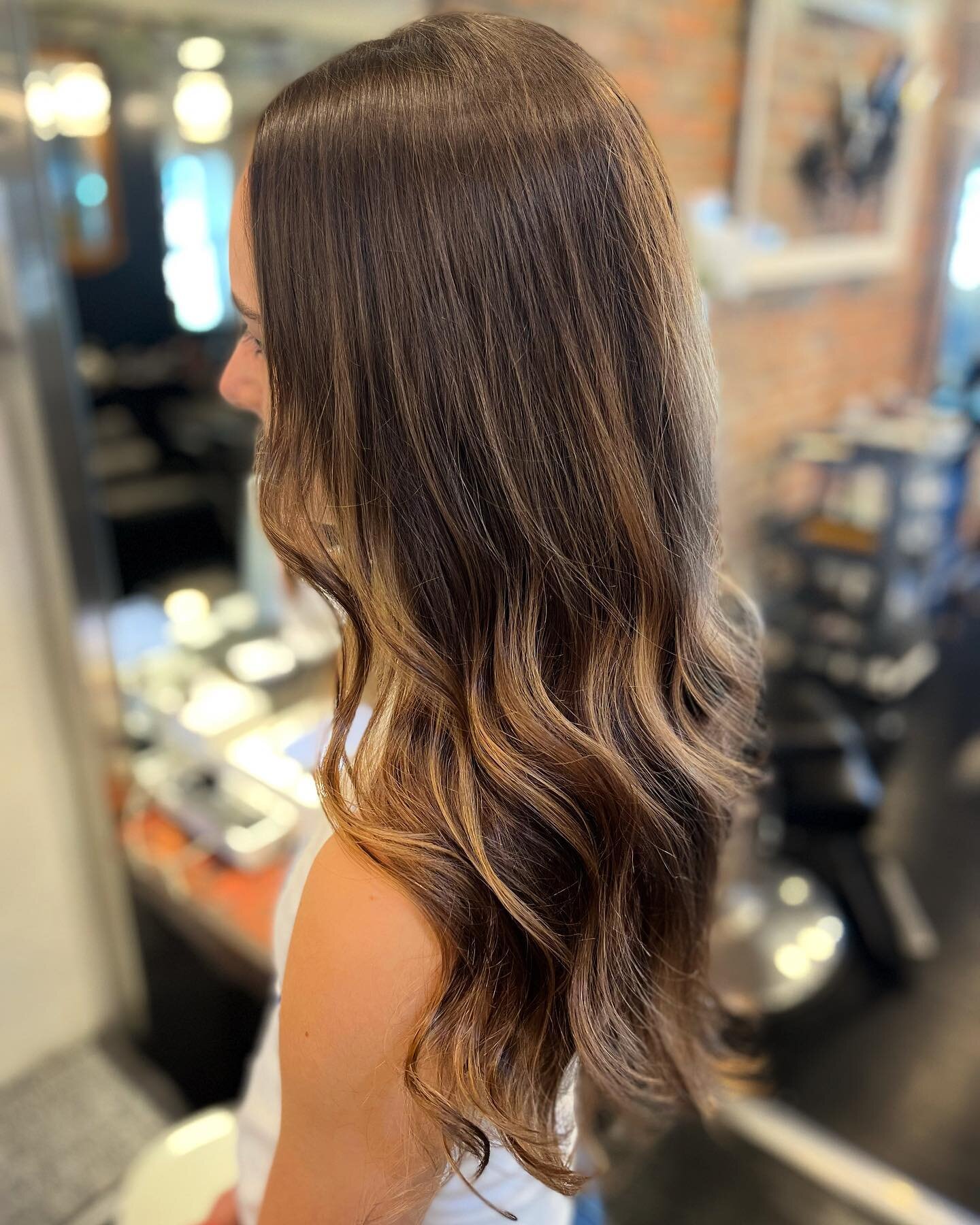 Subtle highlights just in time for summer. Hair by Kate