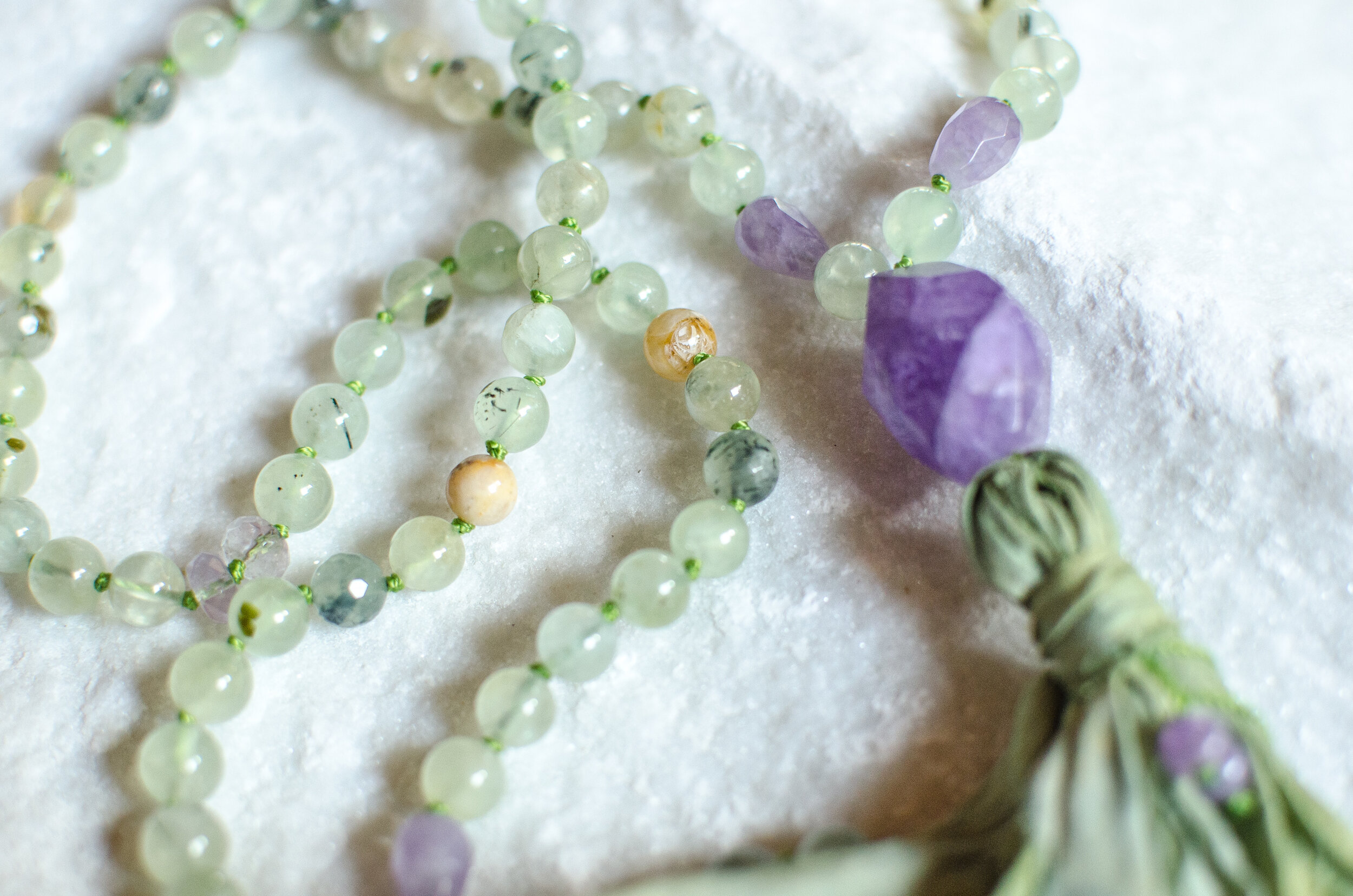Amethyst. Prhenite. Citrine. Garnet. Love. Turmeric/Indigo Dyed Tassel. OM JYOTIR ATMA: I am The Highest Light -- Radiance** * Cooling ~ crisp ~ refreshing. When the heat becomes unbearable, we relax and melt into the warmth. It is here - in our melting - we find SOLACE. A new kind of Joy ~ Born from our own willingness to Surrender.