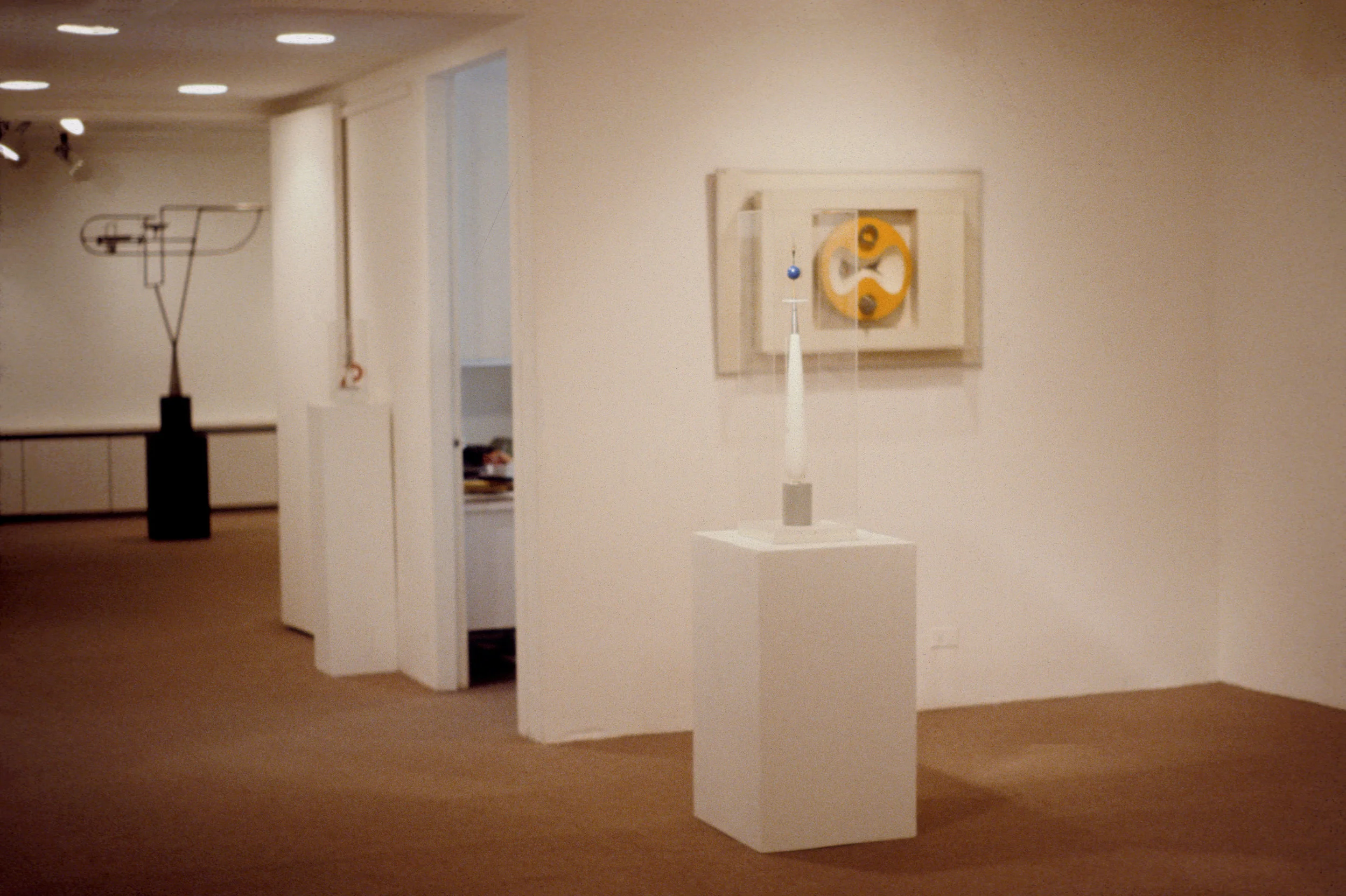 From left to right on floor: Spatial Construction (1944), Ascension (1939) On wall: Yellow, White, and Steel (1943)