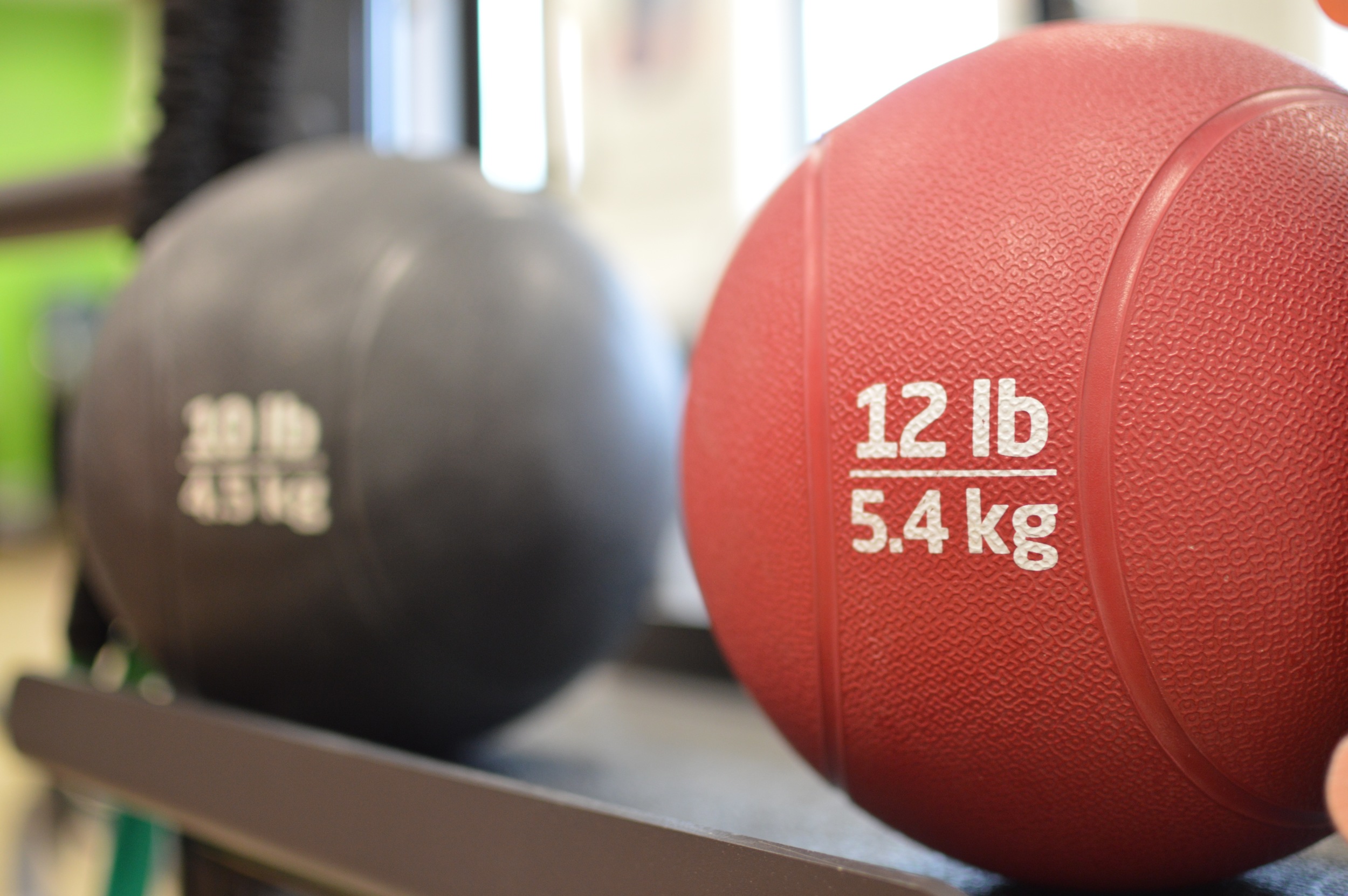 Close Up Image Of Weight Balls Available In Physical Therapy Area