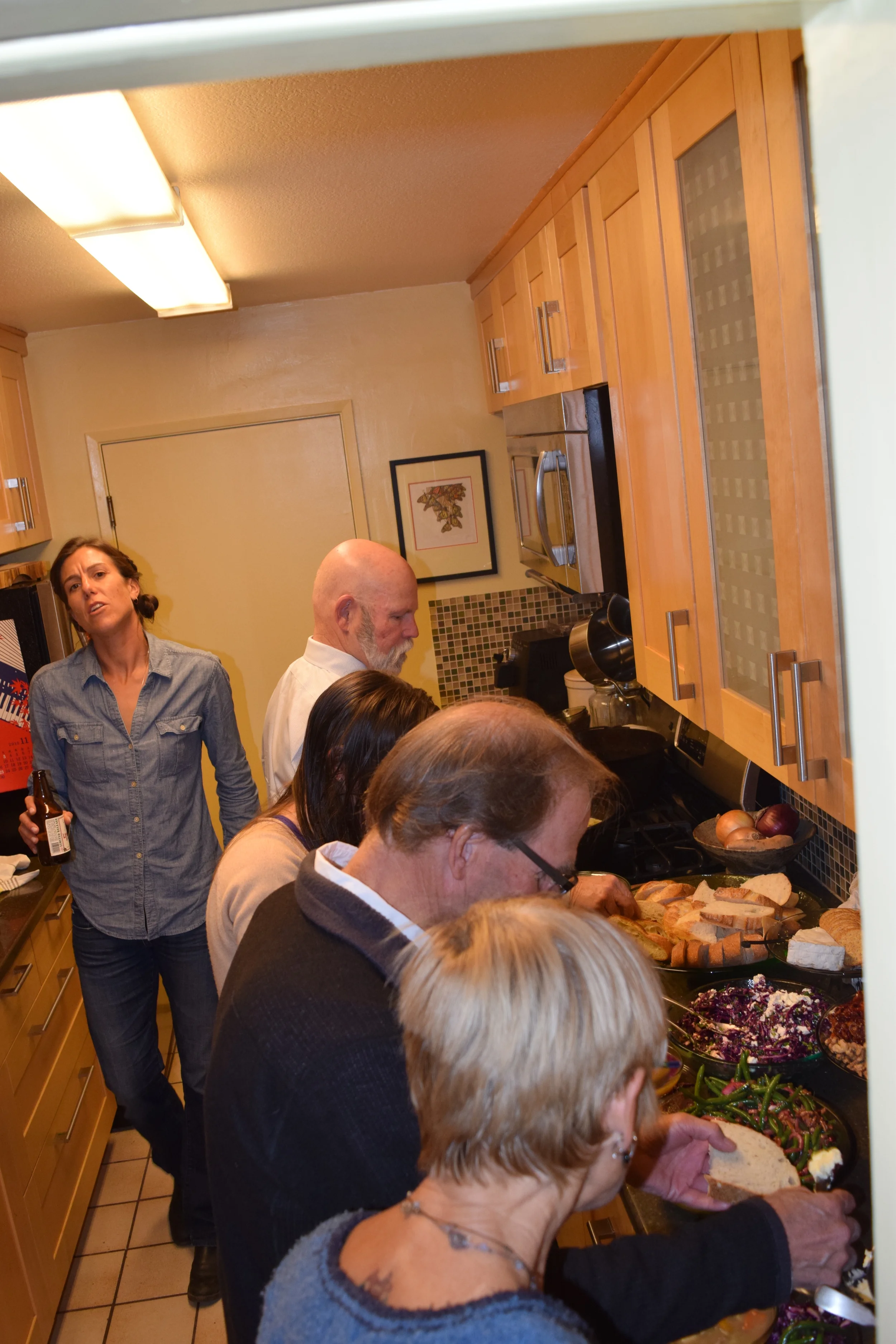 Heaven: a beer in hand; a kitchen full of food and friends! Disregard what may look like a pained facial expression. What was more likely was that I was actually singing a hymn here.