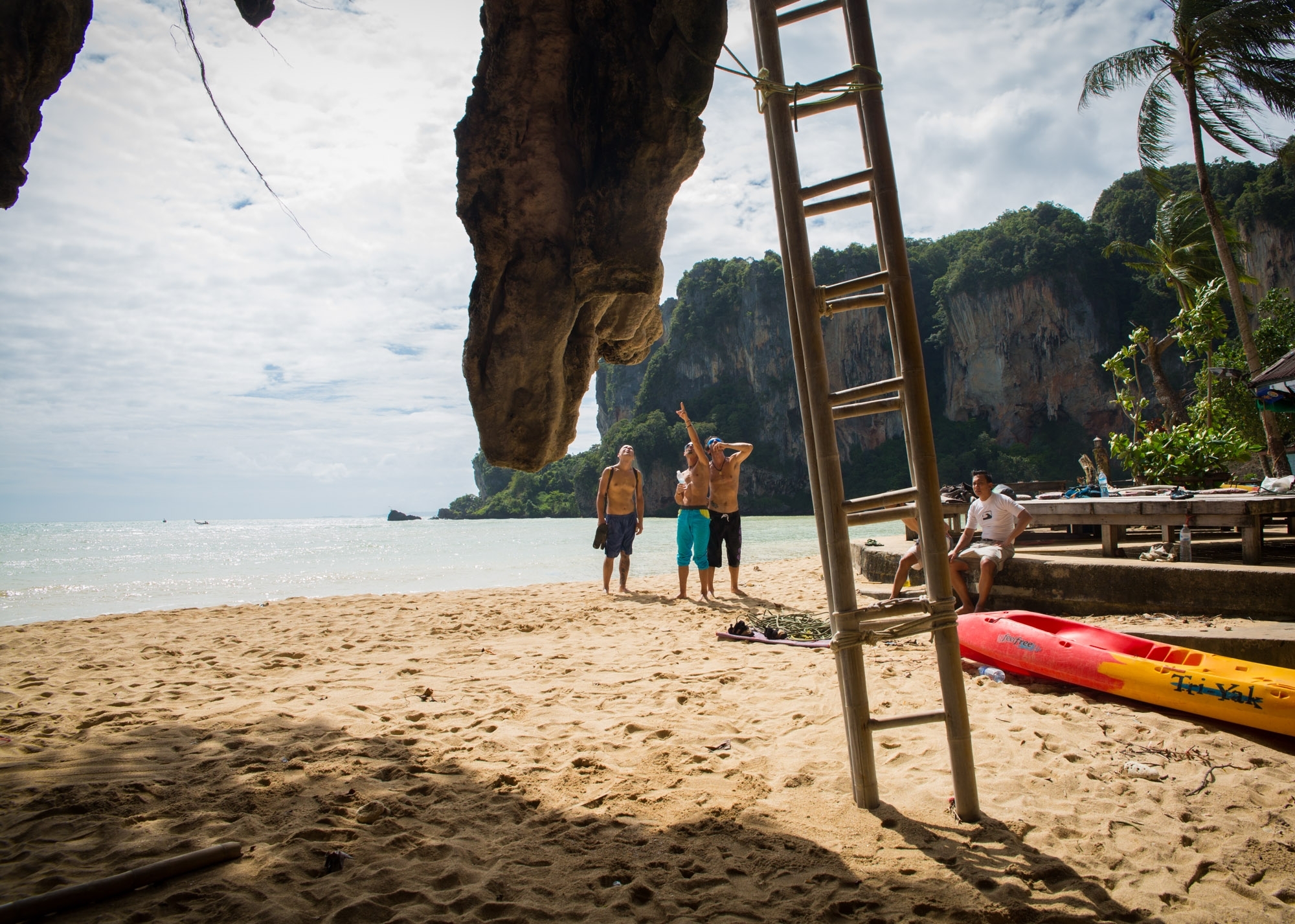 Tonsai Beach, in the province of Krabi, Thailand, is a quiet climber's paradise surrounded by the Andaman Sea and neighbouring communities. There is only one main street and a population of 100. Electricity runs on the beach from 5 pm to 6 am. To get to the beach, you must walk through a dense rocky path from nearby Railay Beach or take a long-tail boat from Ao Nang.
