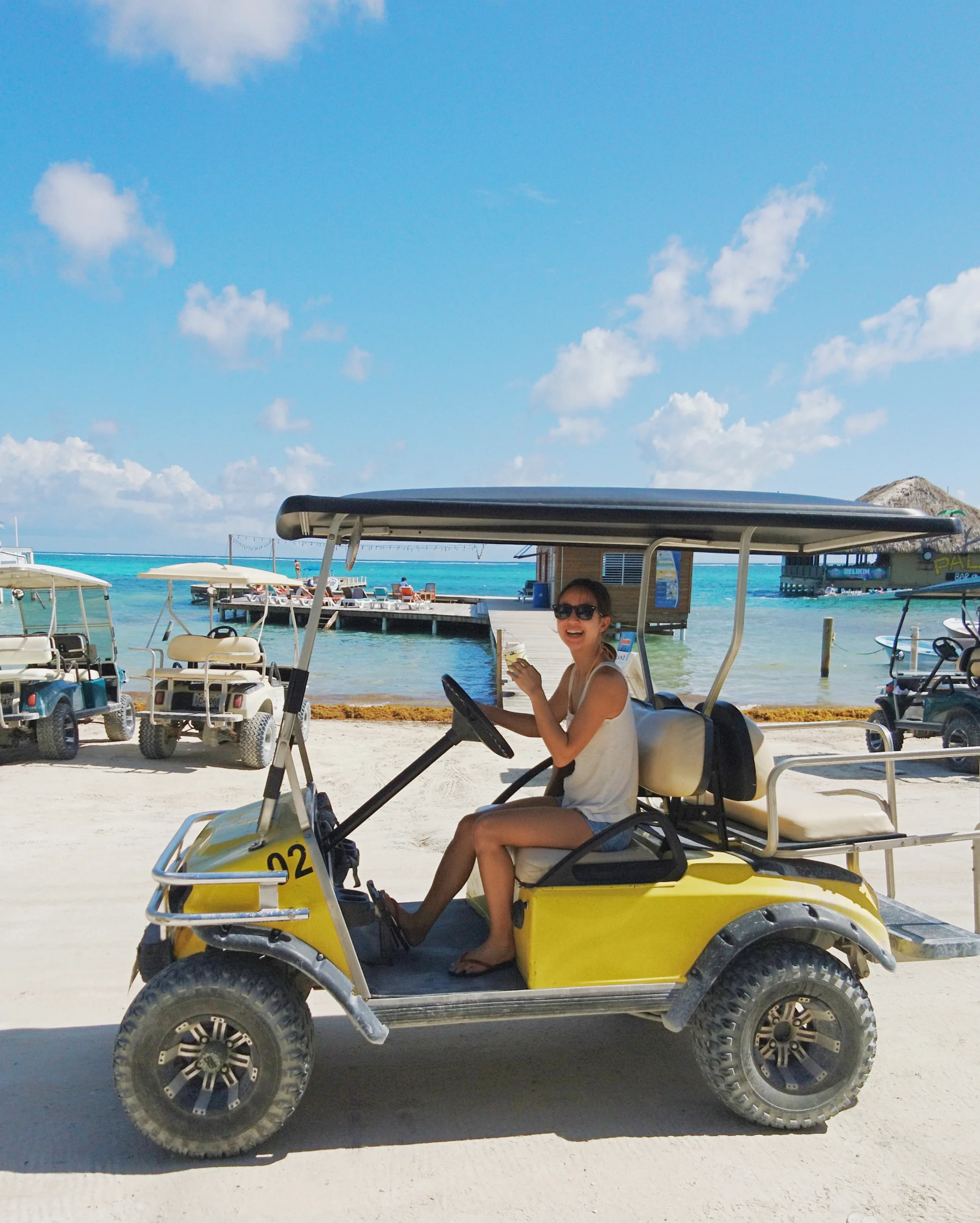 Driving a golf cart to get around town in San Pedro, Belize