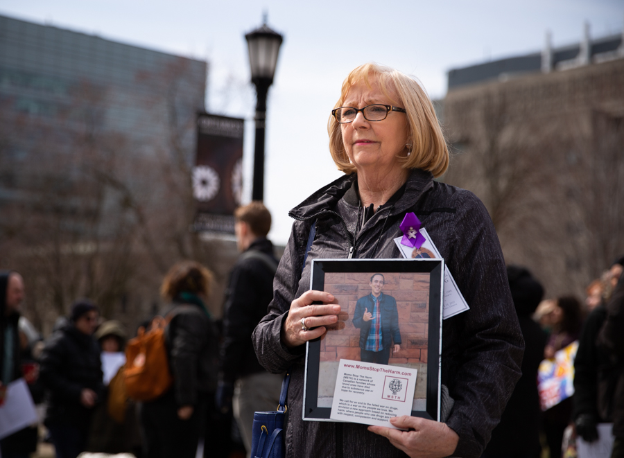 Irene Paterson holds up a photograph of her son Roger Wong who died in June 2017 of a fentanyl overdose in a downtown Toronto parking lot. For The Globe and Mail