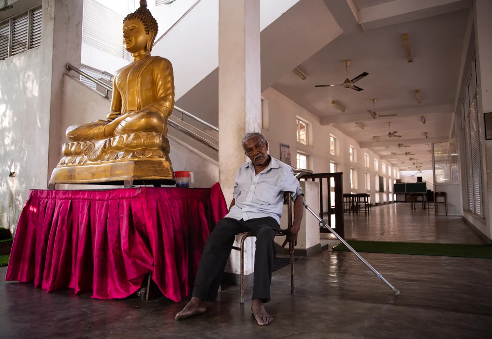 A caretaker at the mostly empty Gangaramaya Temple in Colombo, Sri Lanka. Sri Lanka was bombed in several places two weeks before this photo was taken. Many visitors cancelled their trips, fearing for their safety. Visitor arrival dropped 80 percent after the attacks, affecting locals relying on tourist income, which is about 4.9 percent of the GDP.