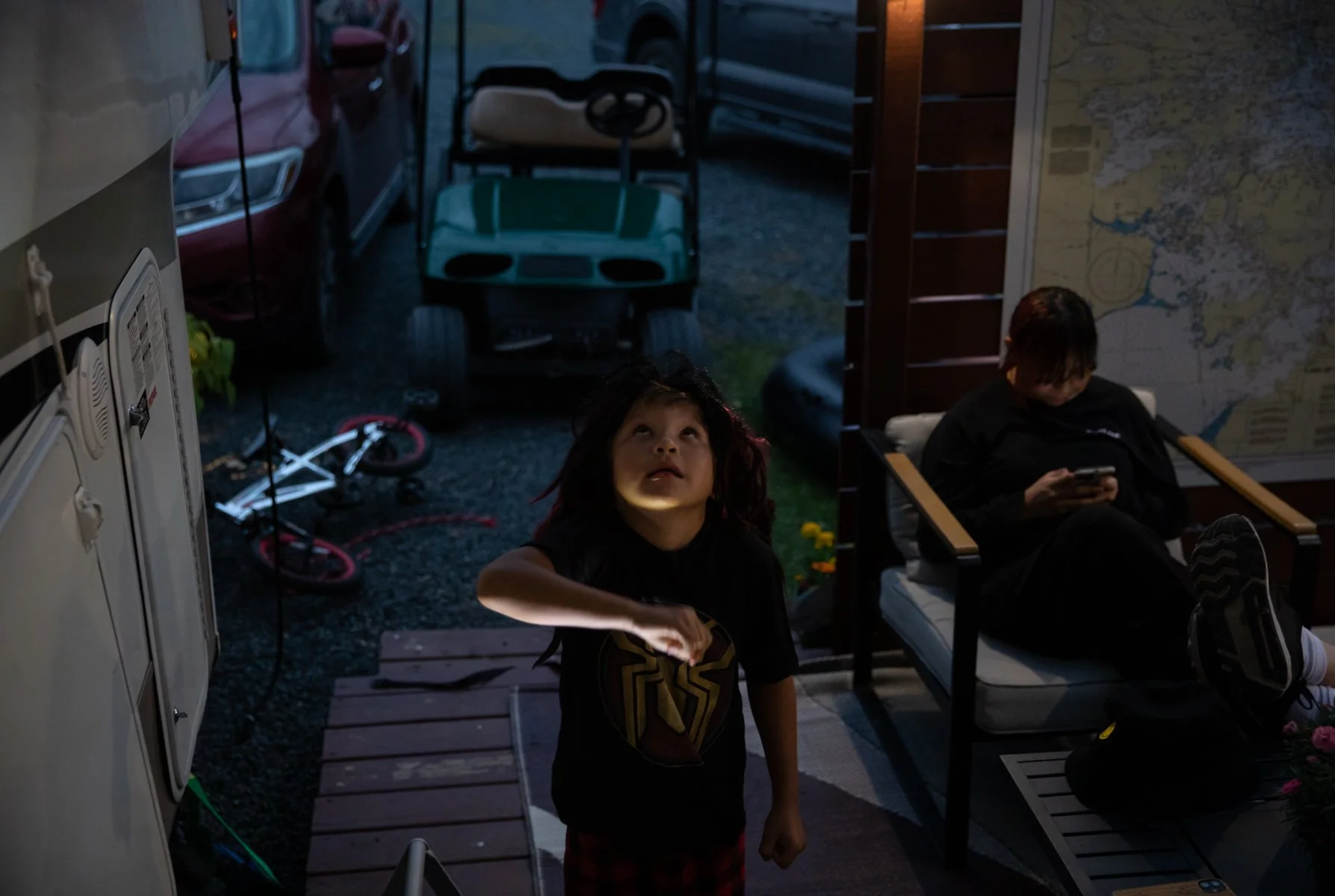  Phoenix, 6, makes shadows with his hands at night. Phoenix is Ruth's foster brother, but they are not related biologically. Phoenix is living with ADHD. 