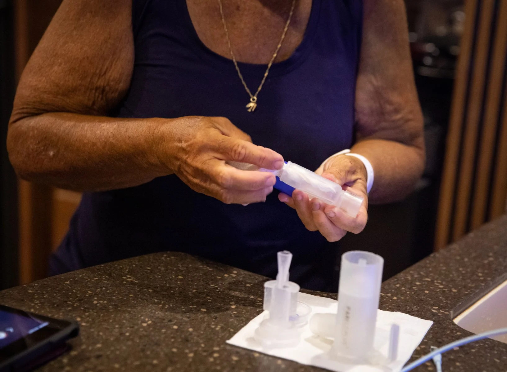  Gail, Ruth's foster mom, cleans equipment Ruth uses to cough for fifteen minutes each night to clear his lungs. 