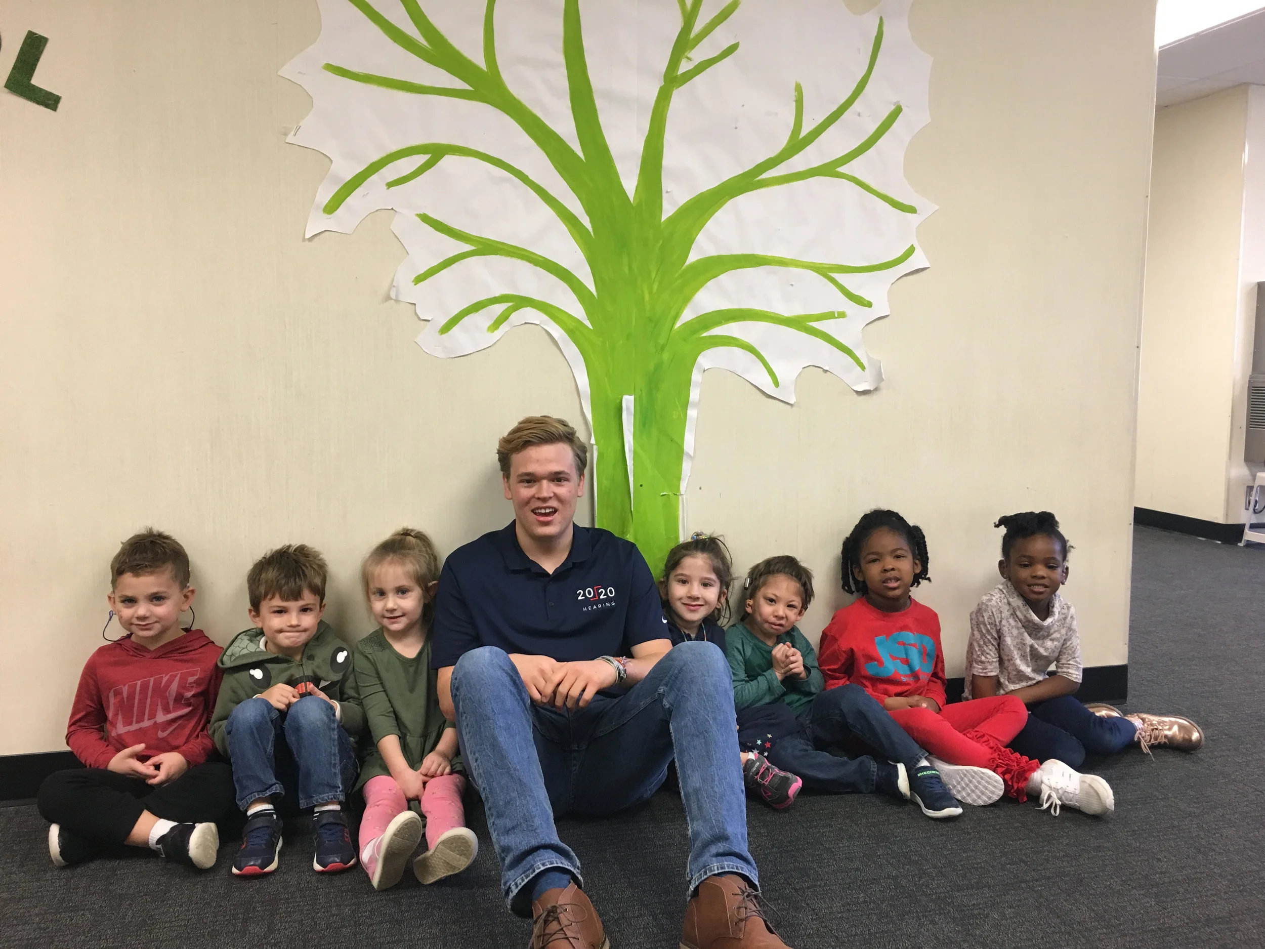 Jack with students under the Giving Tree at the Atlanta Speech School; where students write down what they have done to earn money to serve other kids in need. Such a beautiful picture of selflessness and generosity!