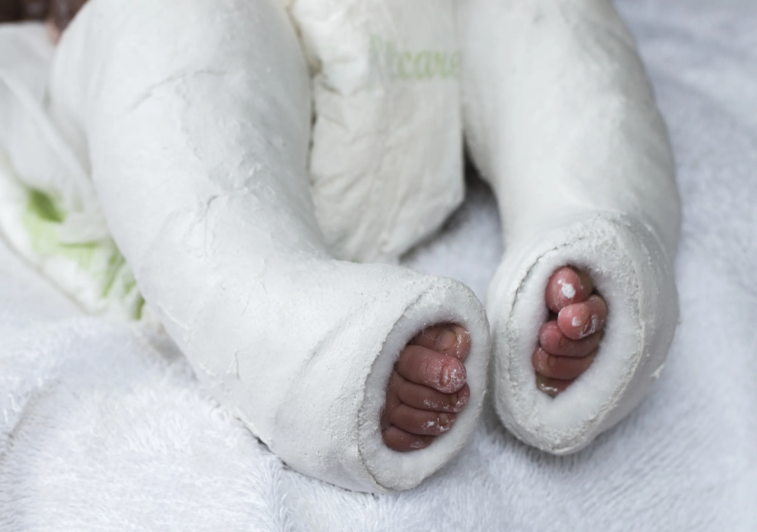 Baby Feet Plastering.jpg